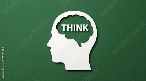 Human head silhouette with brain cutout and think text on green background