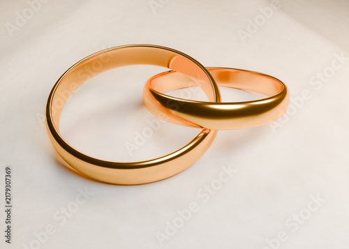 Cuadro en lienzo Two intertwined golden wedding rings symbolizing love marriage and romantic