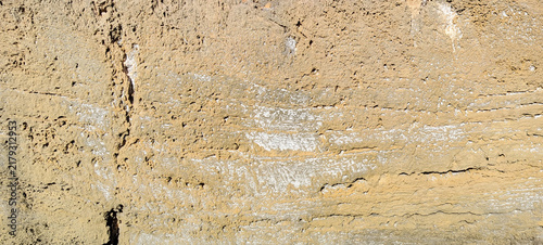 Bild auf Leinwand Weathered porous limestone rock wall surface texture background with rough pits