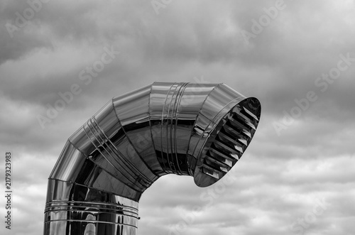 Industrial ventilation steel pipe shiny metallic exhaust cowl monochrome background