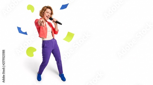 Young woman singing into a microphone with floating abstract shapes on white background