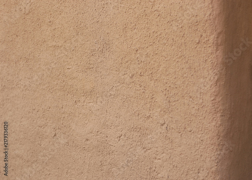 Wall of clay house structure, home building from mud. Selective focus