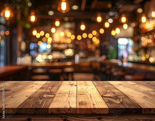 Wooden tabletop in focus; blurred background of a warm-lit bar