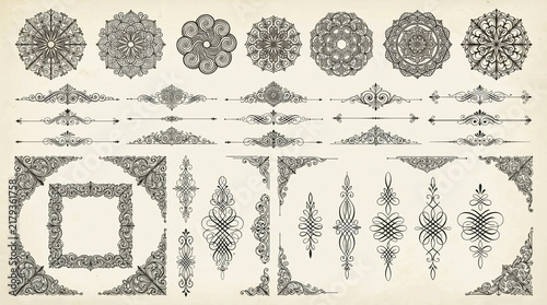 Ornate vintage collection of hand drawn floral mandalas and elegant calligraphic dividers with decorative corner frames isolated on a soft textured cream colored paper background