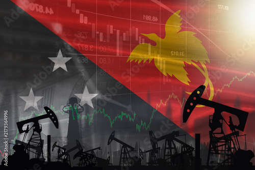 Oil pumps with the Papua New Guinea flag in the background. Oil business concept in Papua New Guinea