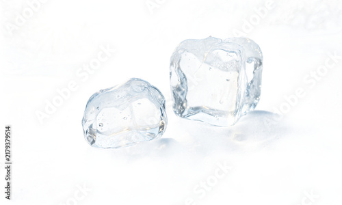 Ice cubes frozen clear two transparent melting ice blocks isolated on a transparent background for cooling beverages and refreshing themes