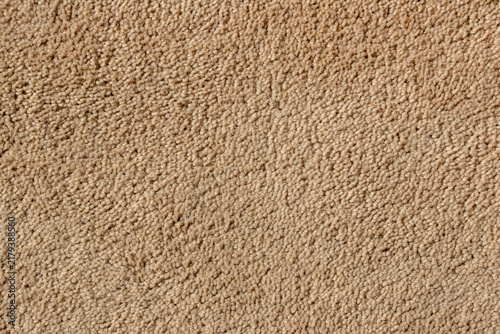 beige carpet fiber texture close up background soft fabric material