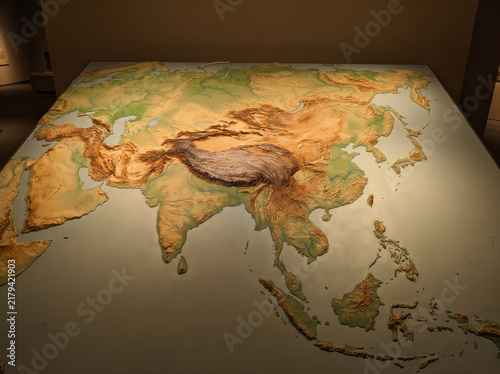 Three dimensional physical relief map of the Asian continent showing topography.