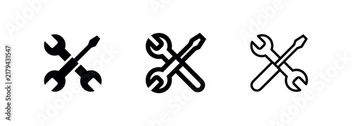 Quadro su tela Wrench and screwdriver icon in three styles: solid black, outlined and shaded, a