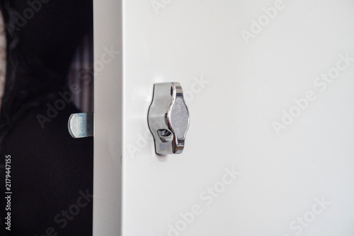 Fotografie Handle-lock on an iron cabinet close up