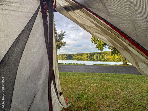 View from tent revealing stunning lakeside scene