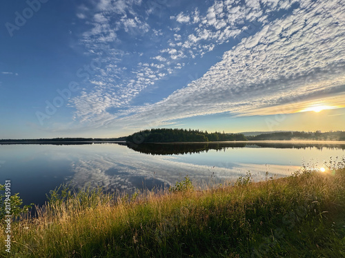 Breathtaking Cloudy Sky over Tranquil Lake View