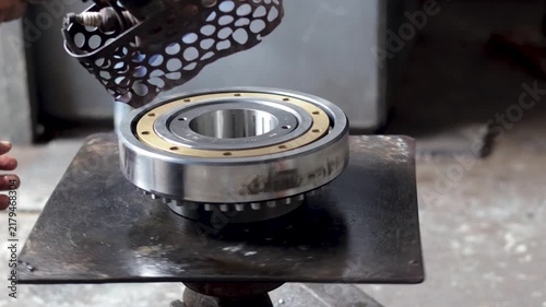 Heavy Duty Cylindrical Roller Bearing Assembly on Industrial Workshop Heating Plate.