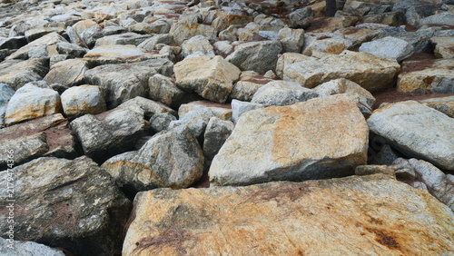Granite Boulders and Coastal Rock Breakwater Texture