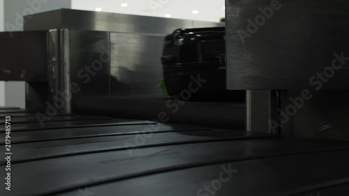 Suitcases moving around on baggage conveyor at an airport, travel, 4k