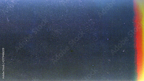 Blank grained film strip texture background with heavy grain, dust and light leak