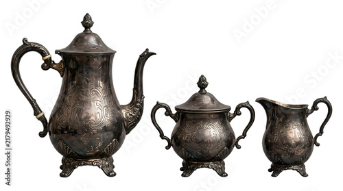 Antique silver coffee pot set with sugar bowl and creamer on white background