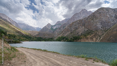 Moody summer landscape view of Marguzor lake in Seven Lakes area aka Haft Kul under overcast sky, Fann mountains, Sughd, Tajikistan
