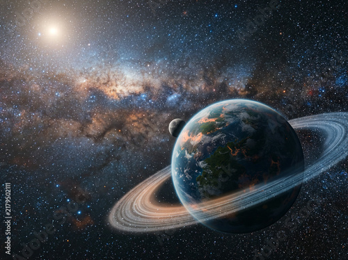 Ringed planet with a moon and distant star against a hazy space nebula