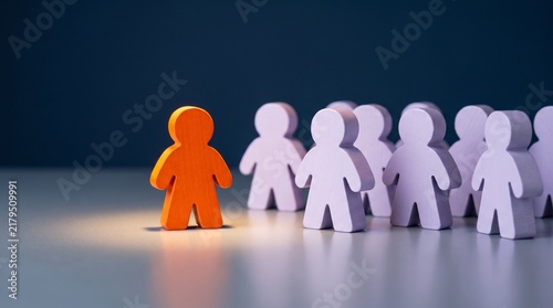 Orange figure standing out from a group of purple people representing unique recruitment.