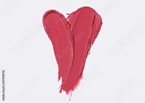Heart shaped lipstick smear on light background