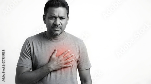 An expression of concern and discomfort with a hand placed on the chest indicating possible health issues or emotional distress