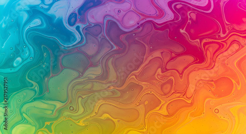 Vibrant Abstract Liquid Flow Background Featuring a Dynamic Blend of Rainbow Gradient Colors in a Swirling Fluid Marble Texture Design