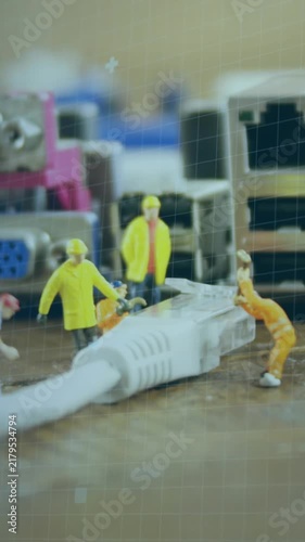 Animation of programming language and circles over figurines and electrical plug