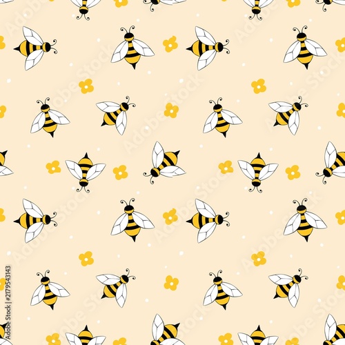 Quadro su tela Seamless pattern with cute cartoon bees and small flowers on a light yellow background