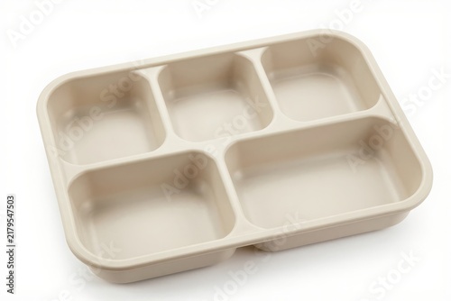 Empty plastic cafeteria lunch tray with five divided food compartments pan.