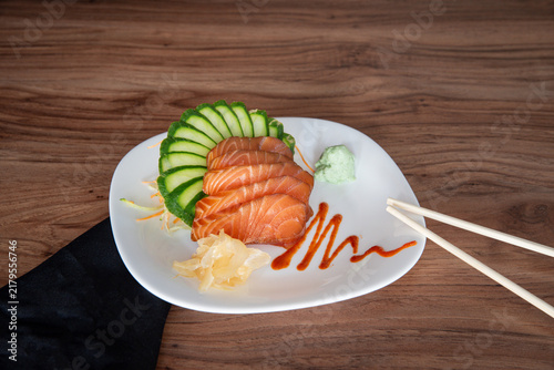 Obraz na płótnie Elegant fresh salmon sashimi plate with wasabi