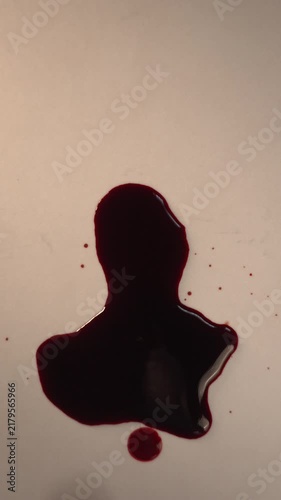 Fresh blood drop falling into pool on light background for forensic DNA analysis, top view macro slow motion, top copy space, vertical video