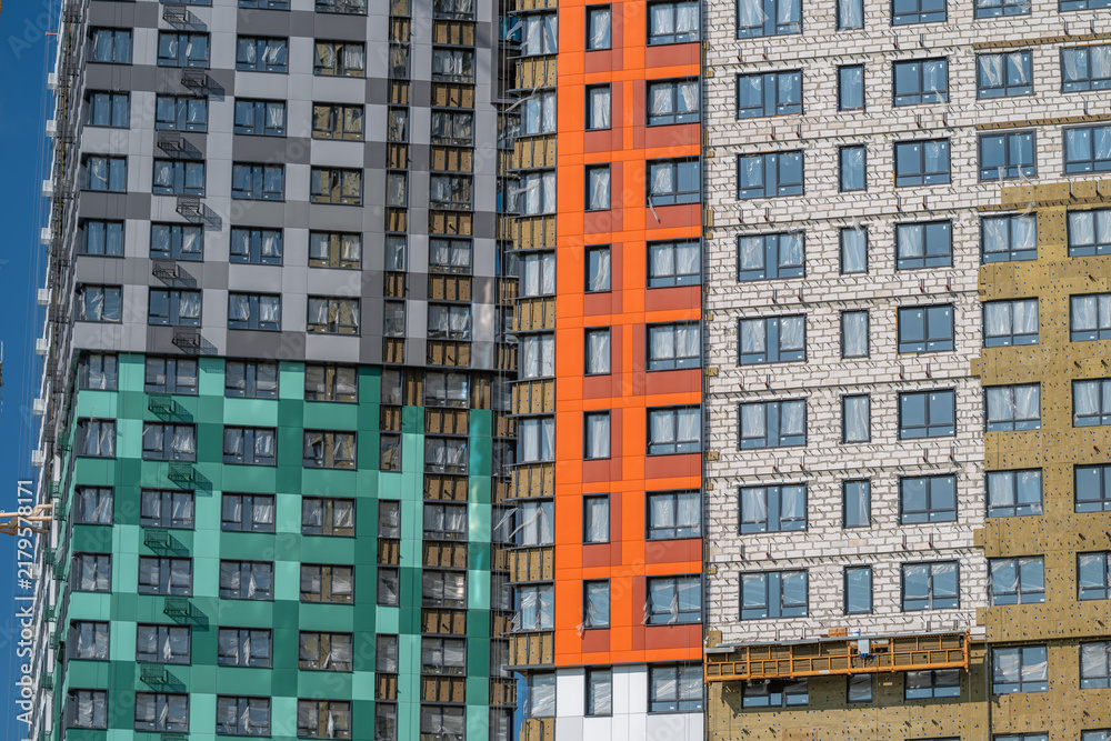 Fototapeta premium Colorful urban buildings showcasing modern architecture under a bright blue sky
