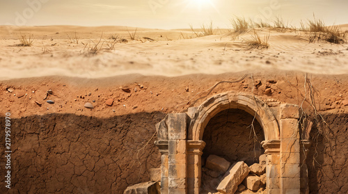 Vertical cross-section of desert sand revealing buried ancient ruins, illustrating archaeological discovery and historical excavation.