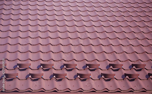 Snow bars (guards, retainers) on the tile roof. Snow hooks to keep snow and ice from rapid, quickly sliding off the roof. Protect from  injure people.
