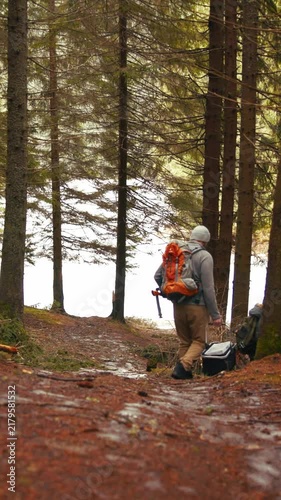 Father and son hiking together in the woods