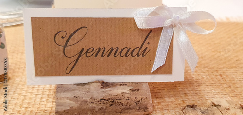 Quadro su tela Rustic wedding place card with handwritten name and ribbon bow