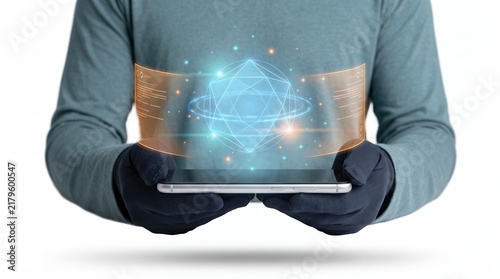 Person in gloves holding a tablet with a futuristic holographic interface displaying a geometric sphere