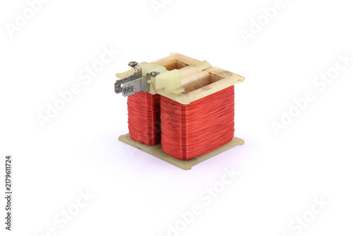 Obraz na płótnie Red varnished wire for creating a magnetic field on a white background