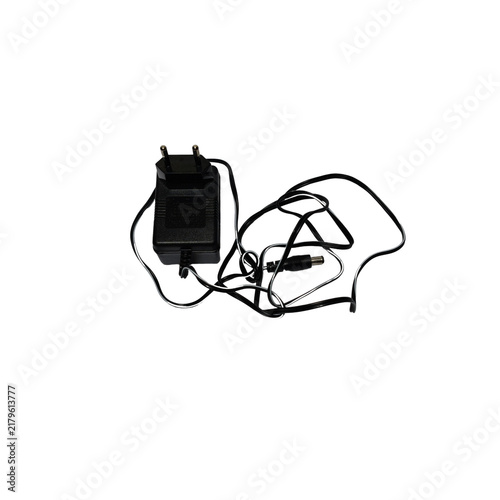 Canvastavla Black electrical machine charger isolated on white background, power supply equipment for charging electronic devices, tools and battery operated machines safely