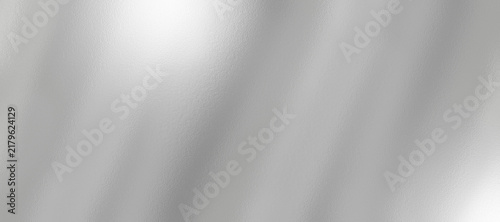 Silver foil texture background with light reflection. Christmas gift background