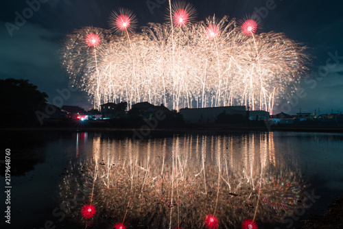 Fotografía Golden fireworks finale reflected in water in Kyoto Japan