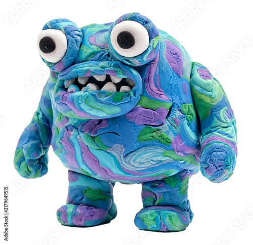 Whimsical blue and purple clay monster with big eyes and sharp teeth