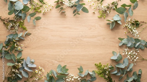  Eucalyptus greenery border on wooden background, botanical flat lay frame texture with copy space for wedding invites, branding, posters, and mockups