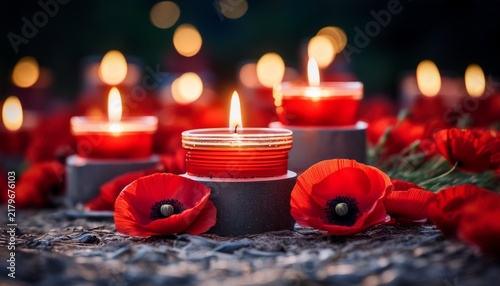 remembrance day tribute lit candles and red poppies for veterans day