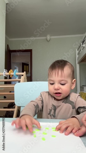 Toddler Engaged in Sticker Play at Home