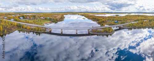 Fotografie Aerial panorama of Nedre Soppero village and the Muonio River bridge, with vibra
