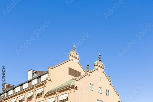 Bild auf Leinwand Oslo historic building roofline against clear blue sky