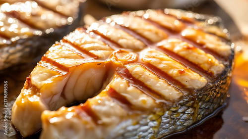 Grilled fish steak piece with grill marks and savory glaze closeup appetizer nutrition delicious