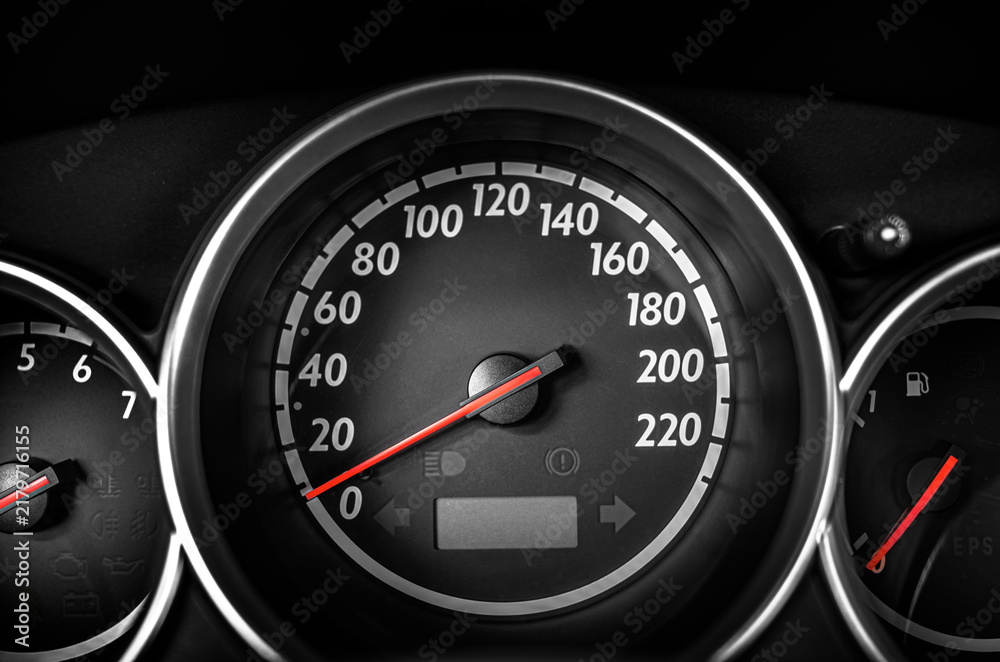 Fototapeta premium Car speedometer displaying the dashboard instrumentation panel with a red indicator needle.